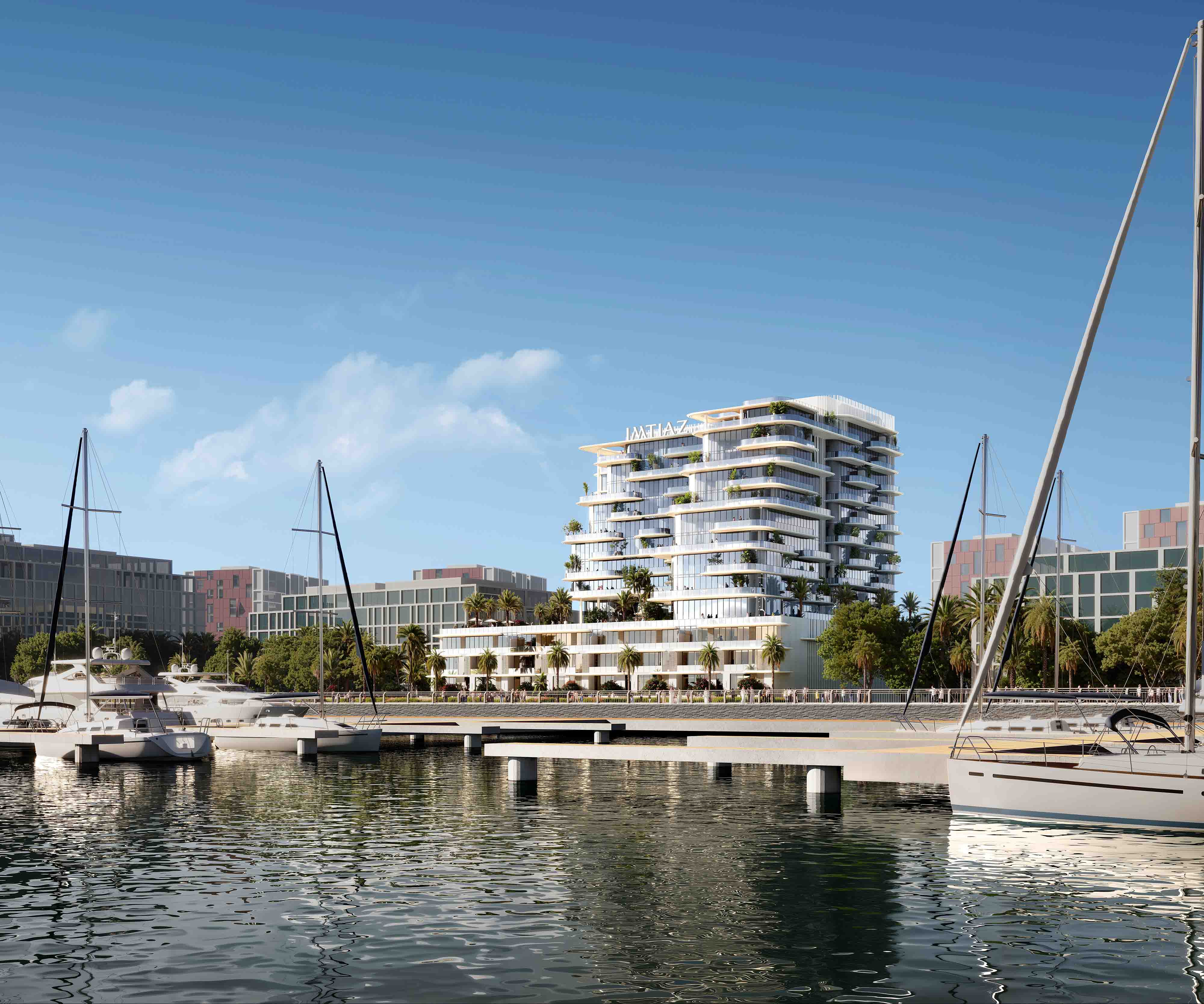 Cotier House 2 By Imtiaz A modern waterfront building with multiple levels, surrounded by palm trees and moored yachts in a marina.